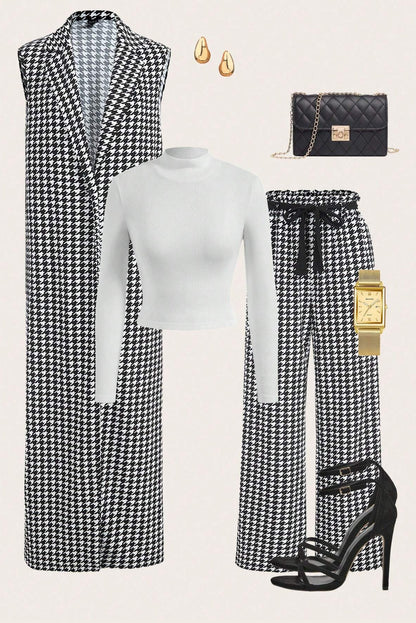 Black and white houndstooth patterned outfit with matching accessories on a light gray background