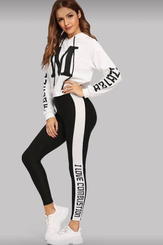 Woman wearing a white long-sleeve top and black leggings with text on a gray background